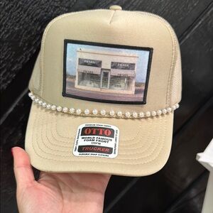 OTTO Beige Trucker Hat with Prada Storefront